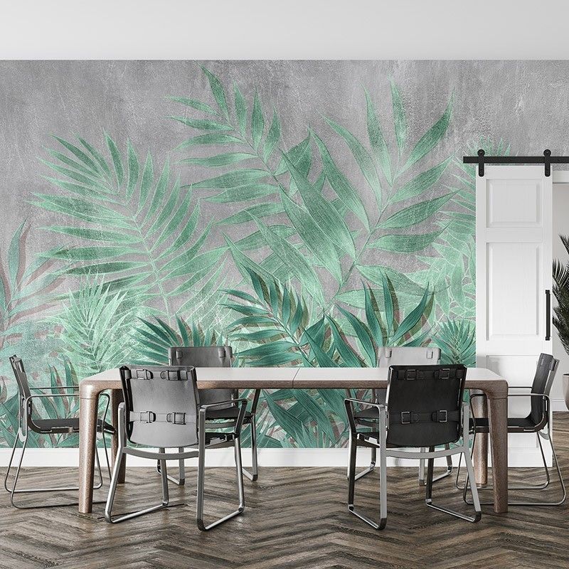 Fototapeta tropikalne liście na tle betonowej ściany
